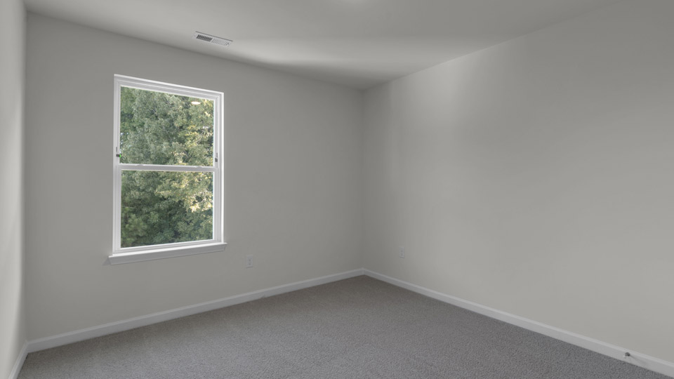 additional bedroom with window, carpeting, closet