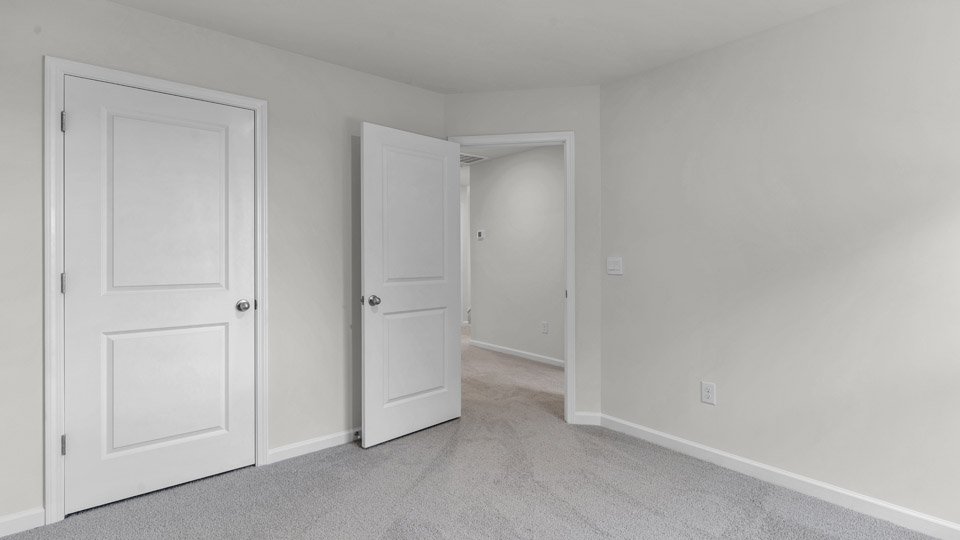 additional bedroom with window, carpeting, closet