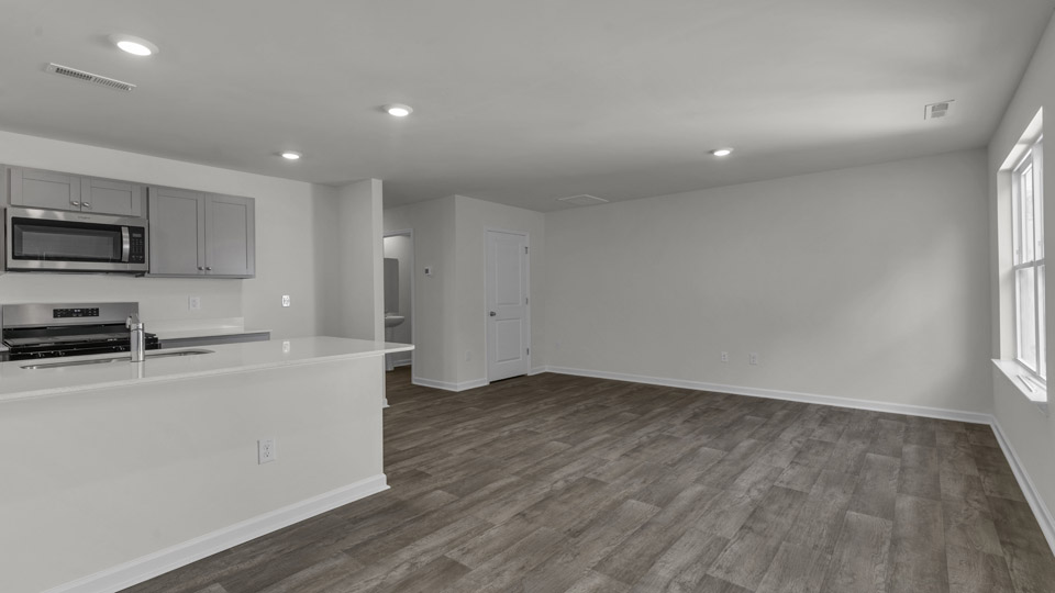 open concept living space with large windows