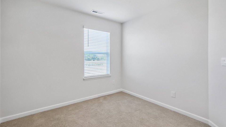 additional bedroom with window, carpeting, closet