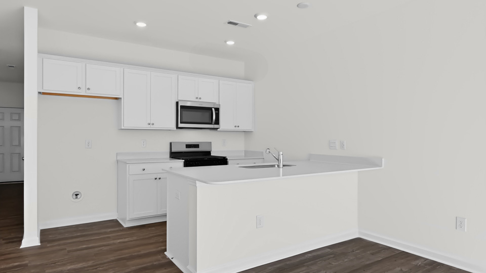 kitchen with white cabinets and quartz countertops