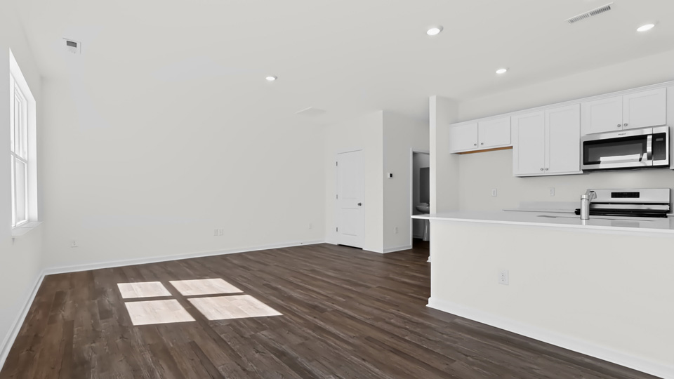 open concept kitchen living and dining areas