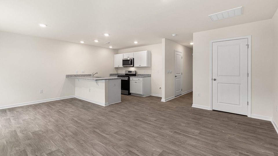 open concept living space with large windows