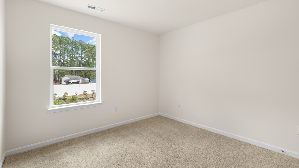 additional bedroom with window, carpeting, closet