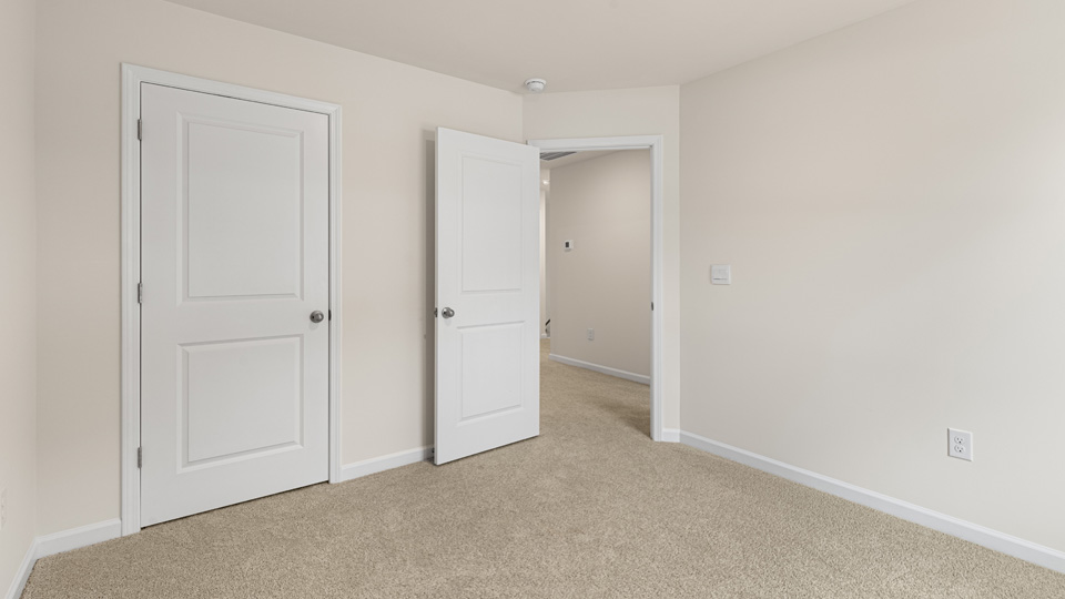 additional bedroom with window, carpeting, closet