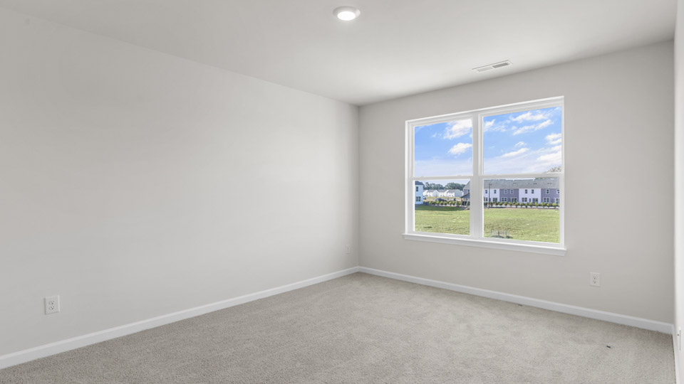 additional bedroom with window, carpeting, closet