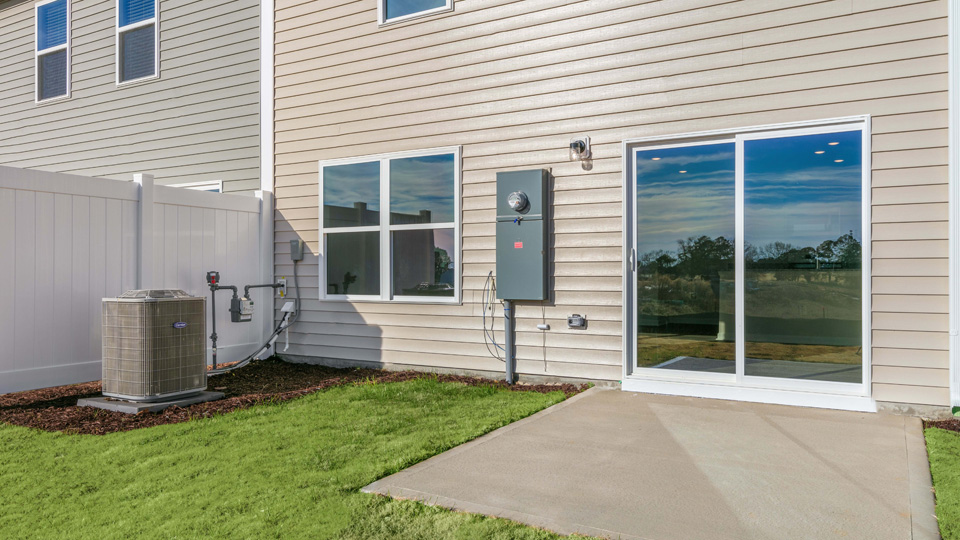 exterior patio with concrete slab and open yard
