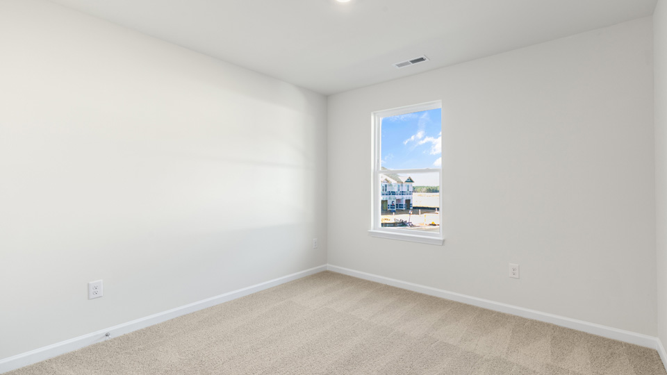 additional bedroom with window, carpeting, closet