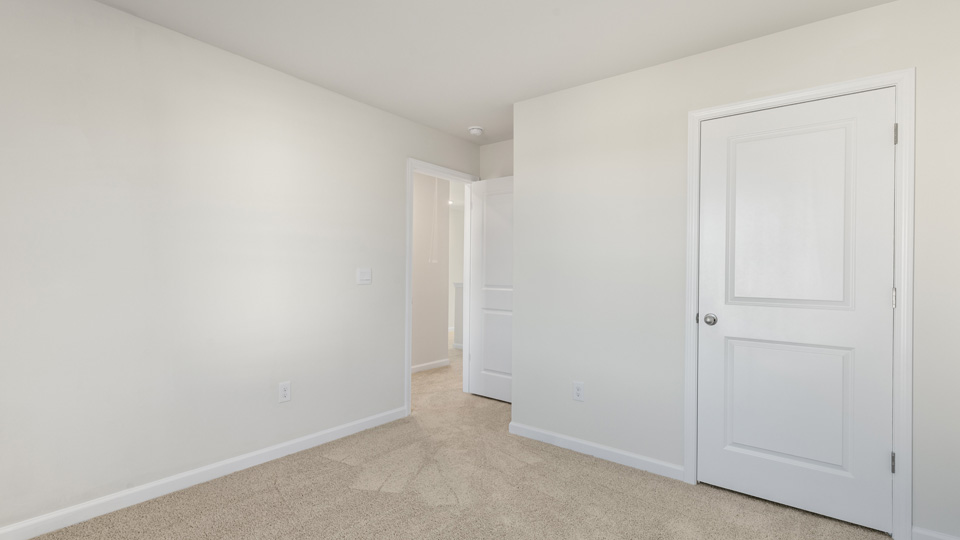 additional bedroom with window, carpeting, closet