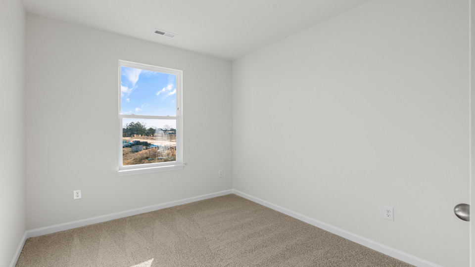 additional bedroom with window, carpeting, closet