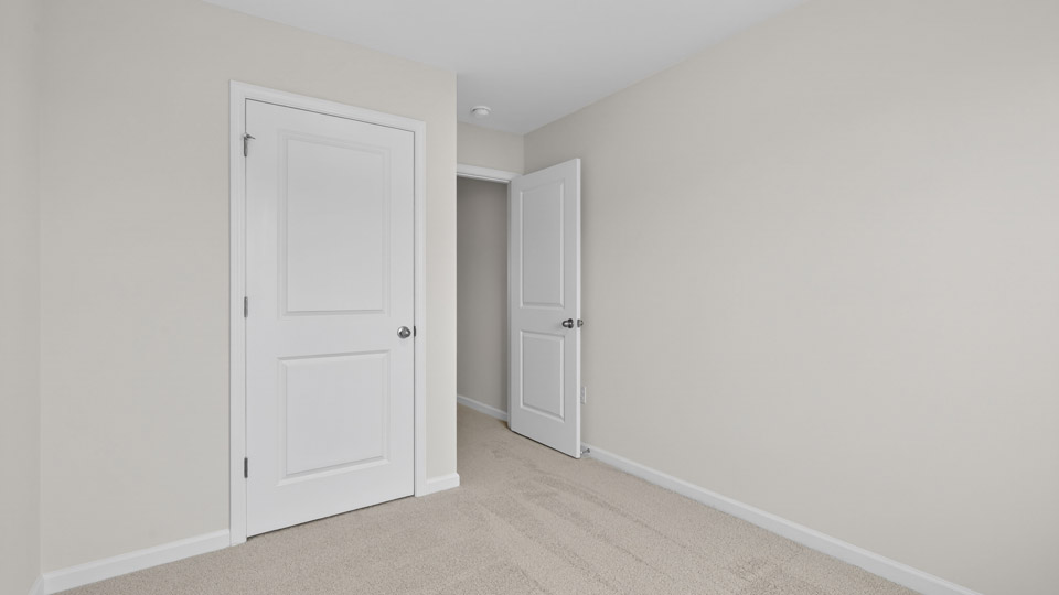 Bedroom with carpet floor and closet
