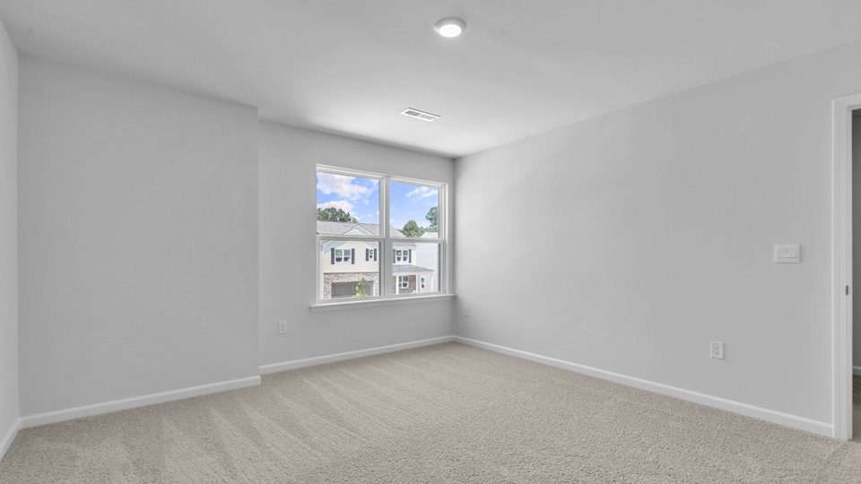 loft with carpet flooring