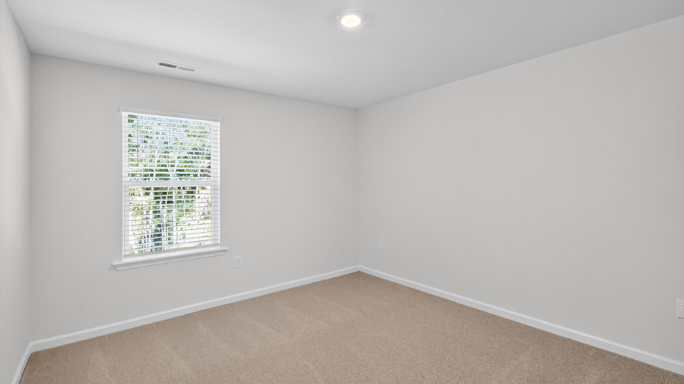 Bedroom with carpet flooring