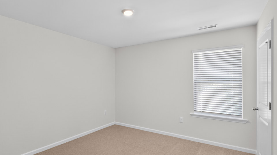 Bedroom with carpet flooring