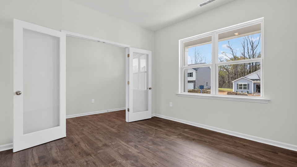 Study room with hardwood floors and big windows