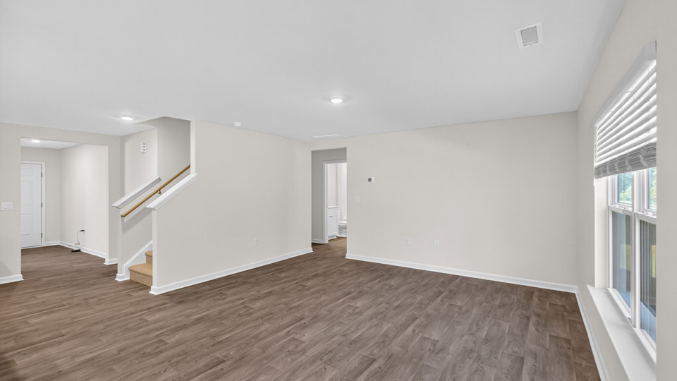 living room with revwood flooring