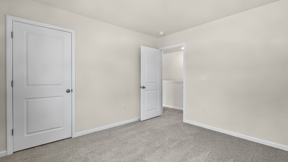 Bedroom with carpet flooring