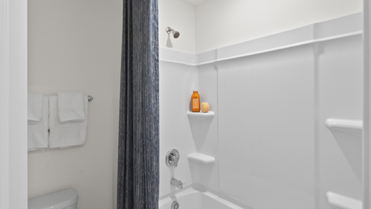 bathroom with tub shower combo
