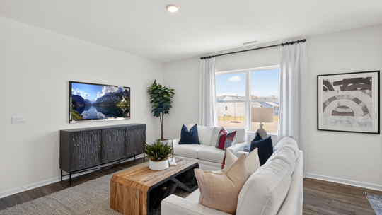 open concept living room with revwood flooring