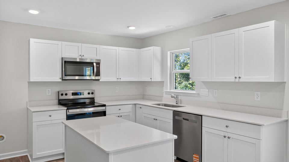 kitchen with white cabinets and quartz countertops