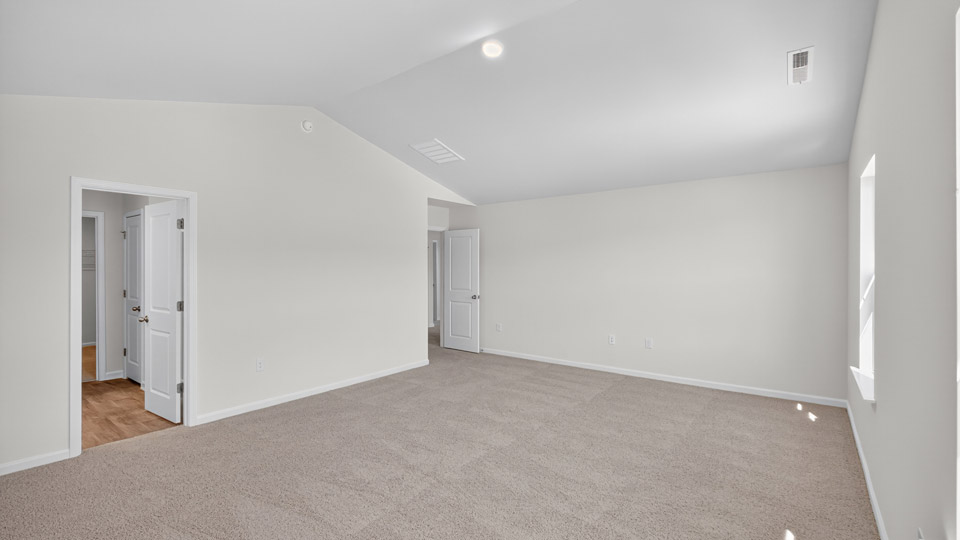 bedroom with vaulted ceiling