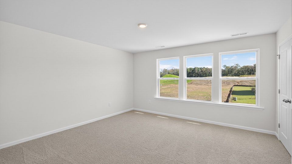 loft with carpet flooring