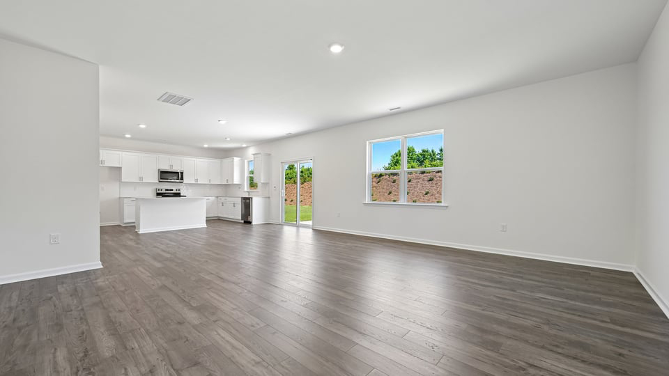open concept living space with large windows