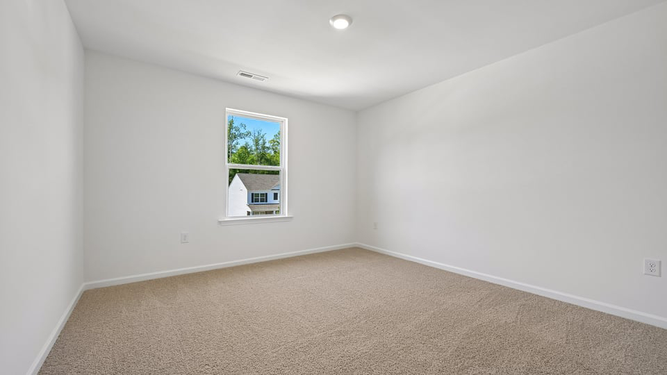 additional bedroom with window, carpeting, closet