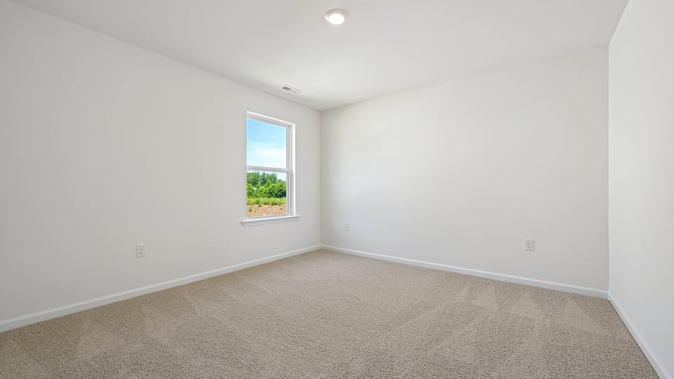 additional bedroom with window, carpeting, closet