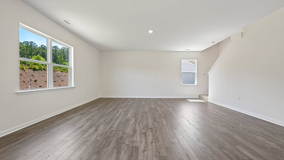 open concept living space with large windows