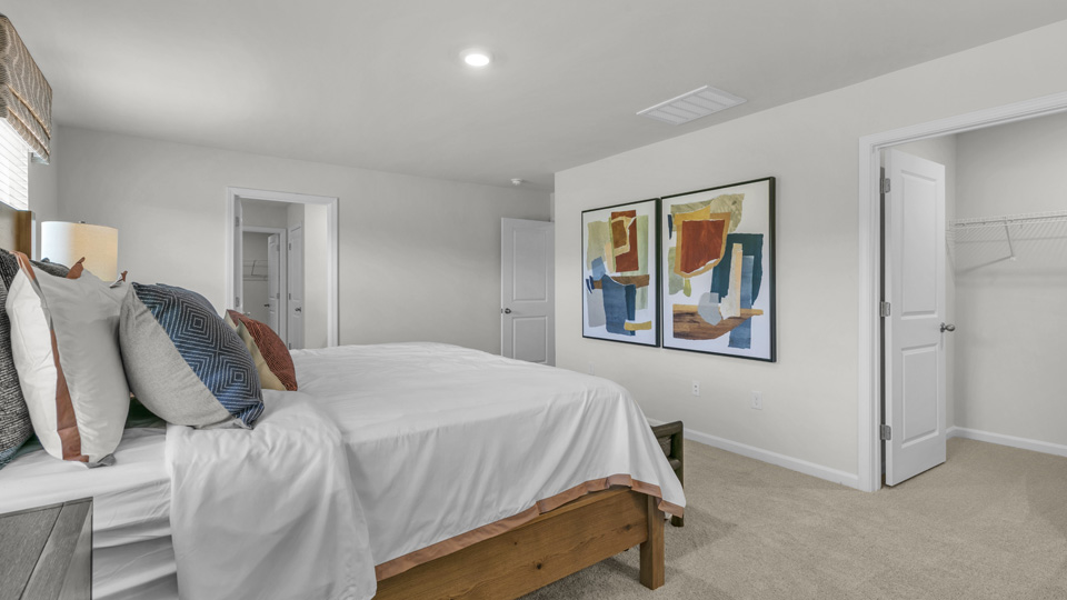 Primary bedroom with carpet flooring