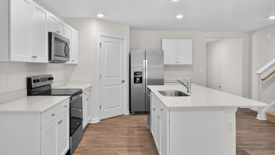 kitchen with white cabinets and quartz countertops