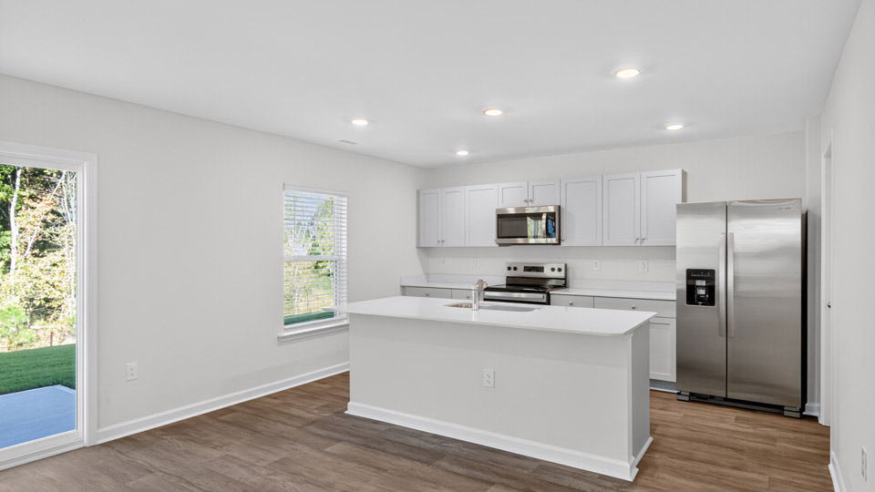 kitchen with white cabinets and quartz countertops