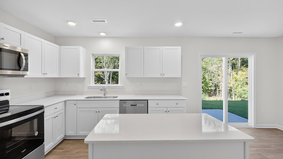 kitchen with white cabinets and quartz countertops