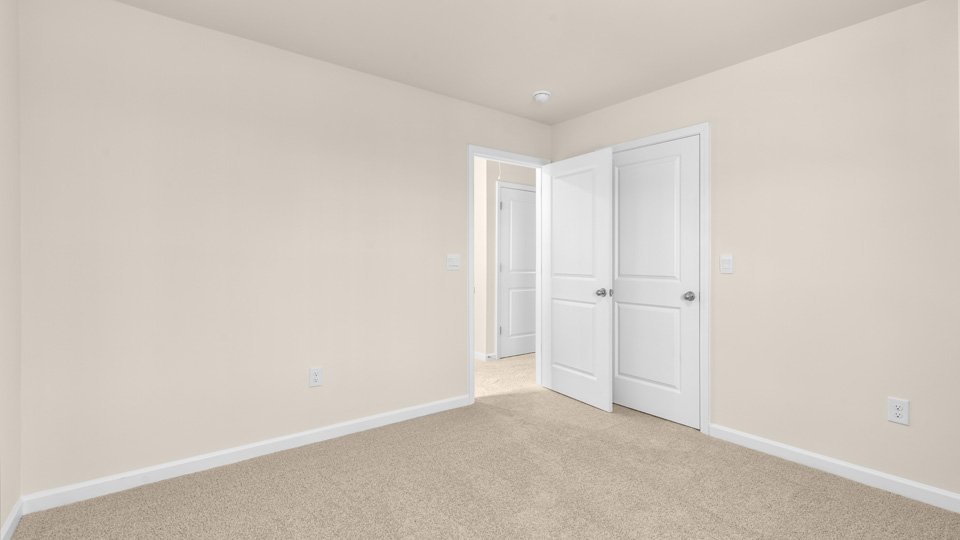 bedroom with natural lighting and carpet flooring