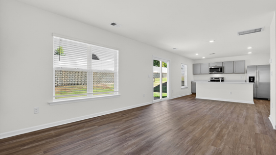 open concept living and dining areas