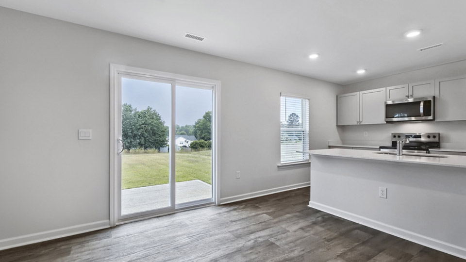 kitchen with gray cabinets and quartz counters