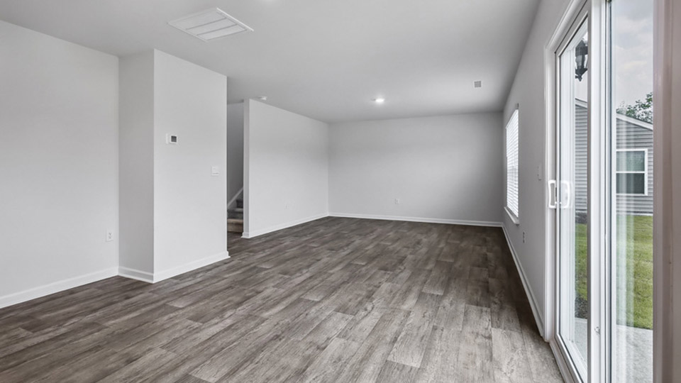 open concept living room with vinyl flooring
