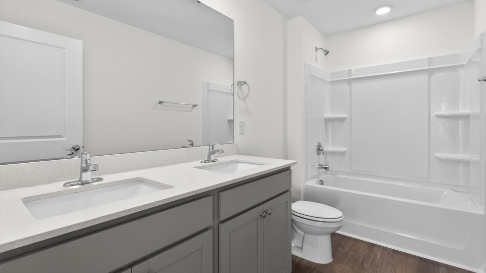 Bathroom with double sink and tub