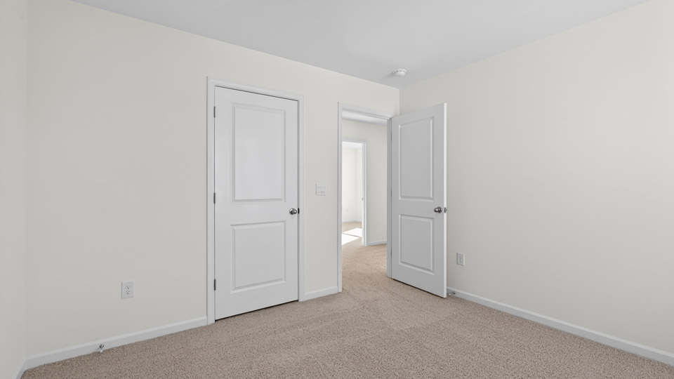 Bedroom with carpet floor and closet