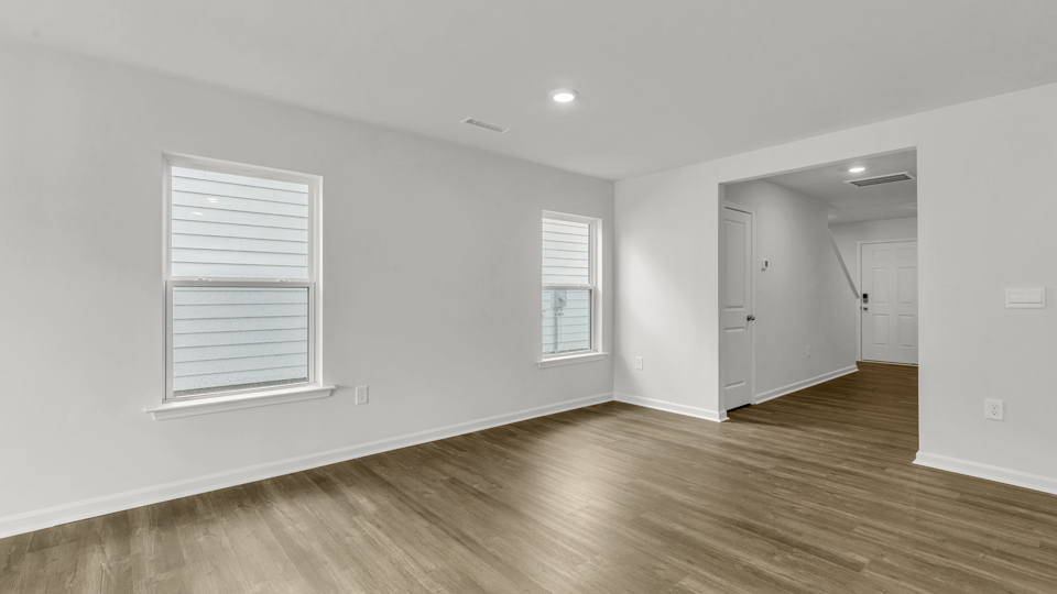 open concept living space with large windows