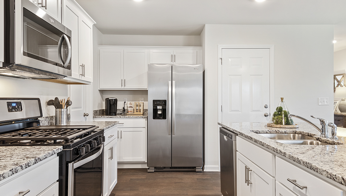 kitchen with stainless steel appliances and quartz countertops
