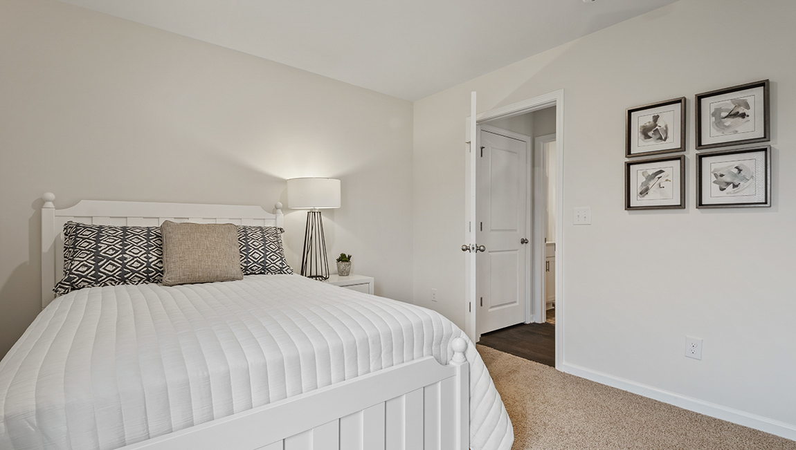 bedroom with natural lighting and carpet flooring