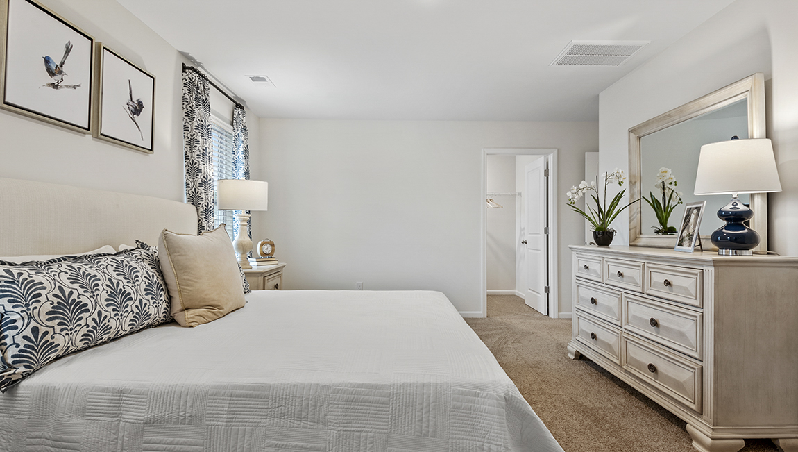 bedroom with natural lighting and carpet flooring