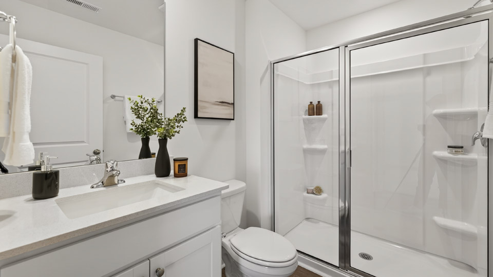 Bathroom with single sink and walk in shower