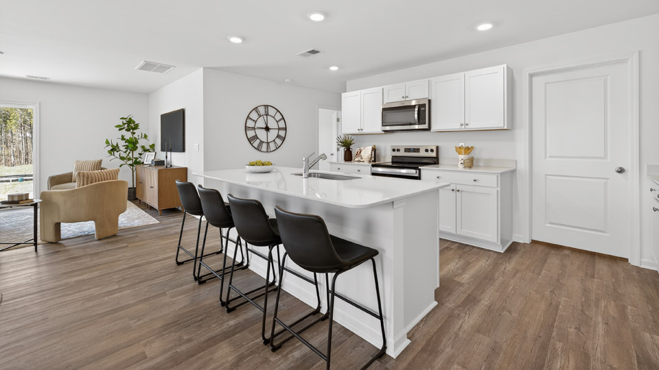 Kitchen with white cabinets and stainless steel appliances.