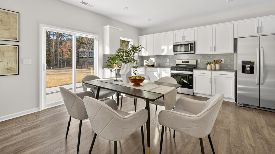 kitchen with dining table and revwood flooring
