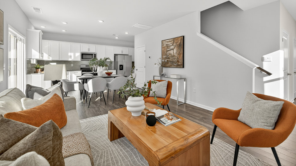 living room overlooked by kitchen with revwood flooring