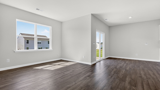 living room with revwood flooring and natural light