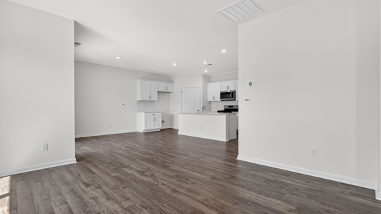 living room with revwood flooring